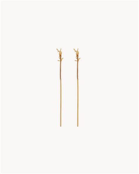 CASSANDRE threader earrings in metal .